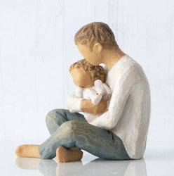 Willow Tree Little One 
seated father holding child in arms Side View 